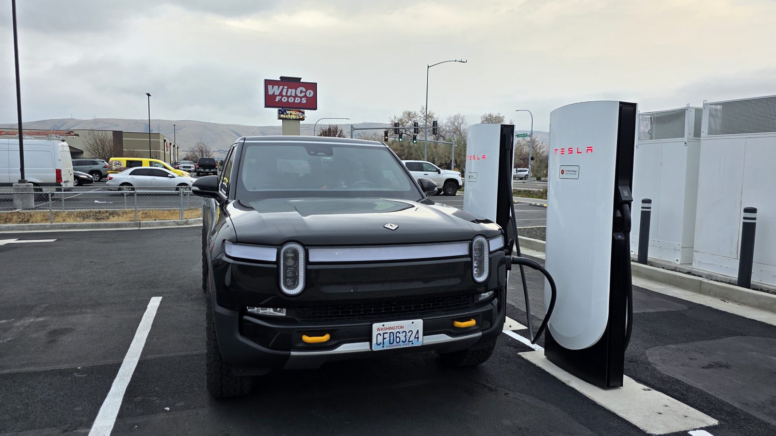 R1S at the first Tesla Supercharger stop