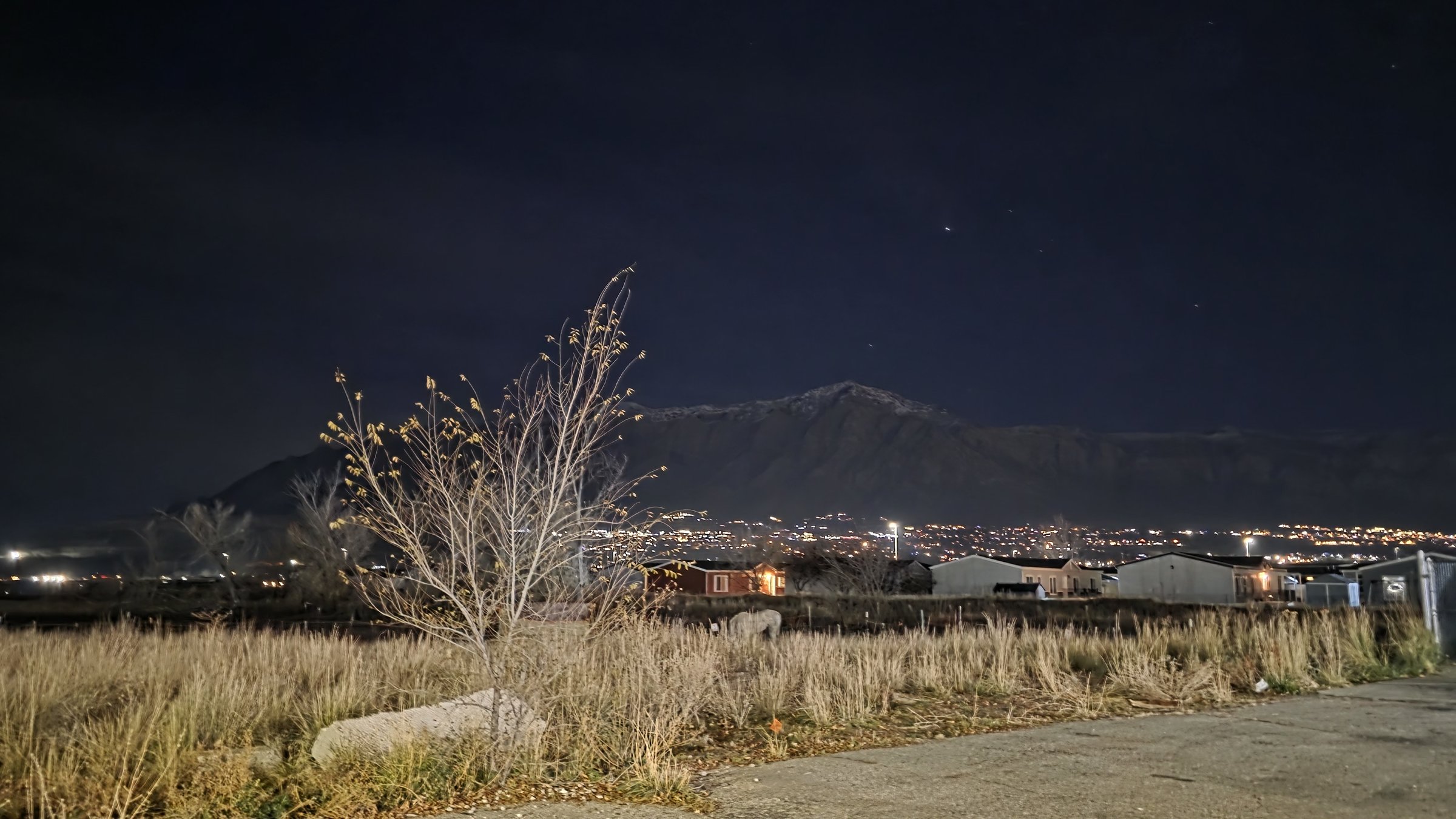Wasatch Front mountains lit up at night from Farr West, Utah