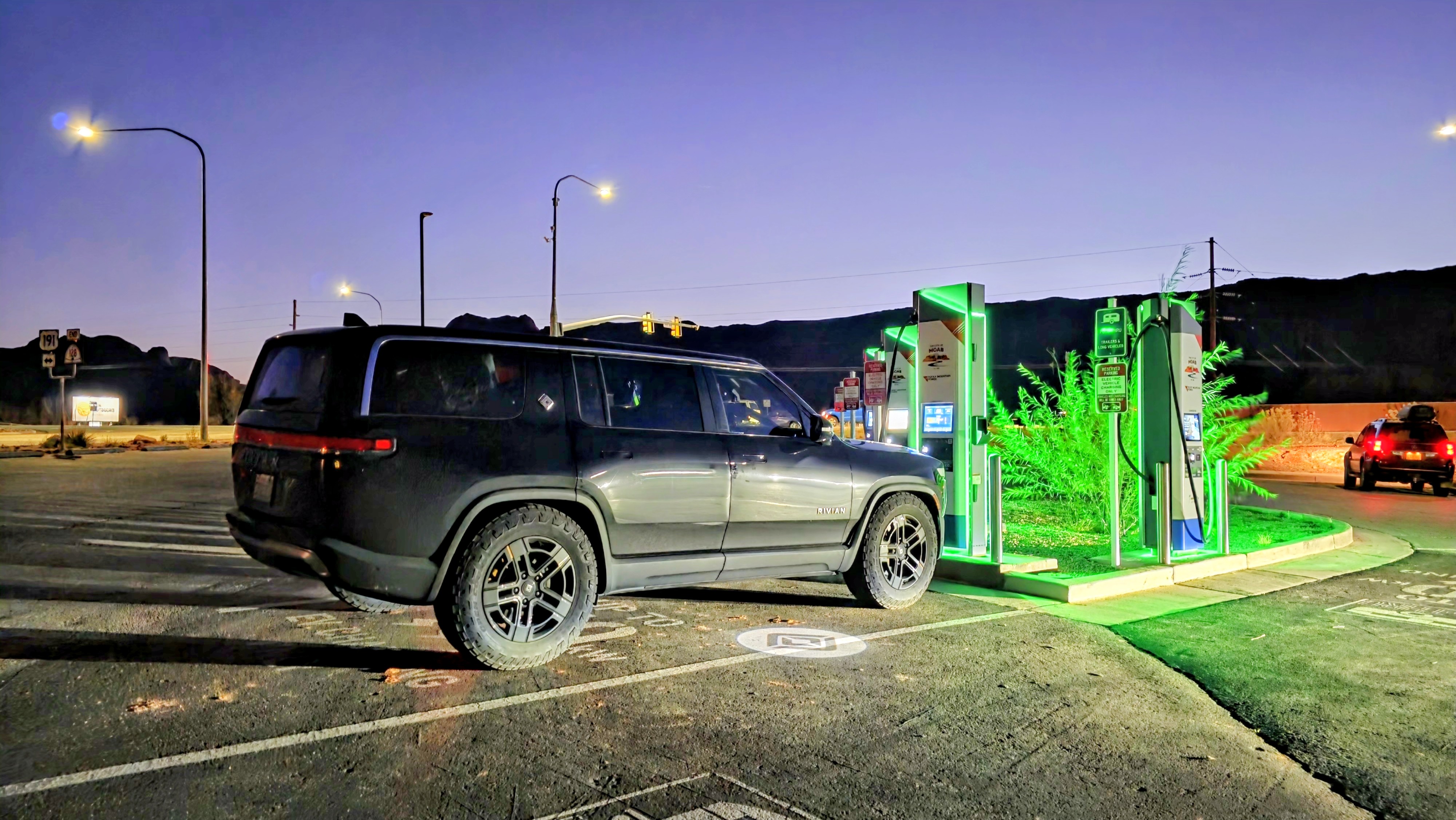 R1S charging at Electrify America in Moab at dusk